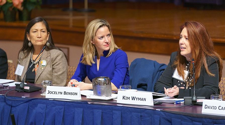 Kim Wyman, secretary of state in Washington, addresses the conference as Deb Haaland, one of the first two Native American women elected to the U.S. Congress, and Jocelyn Benson, secretary of state in Michigan, listen.