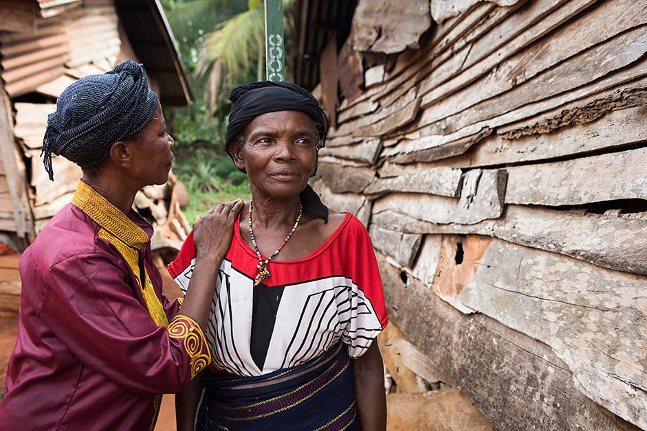 Chibueze measures the height a woman in her village to determine proper dosage of medication. 